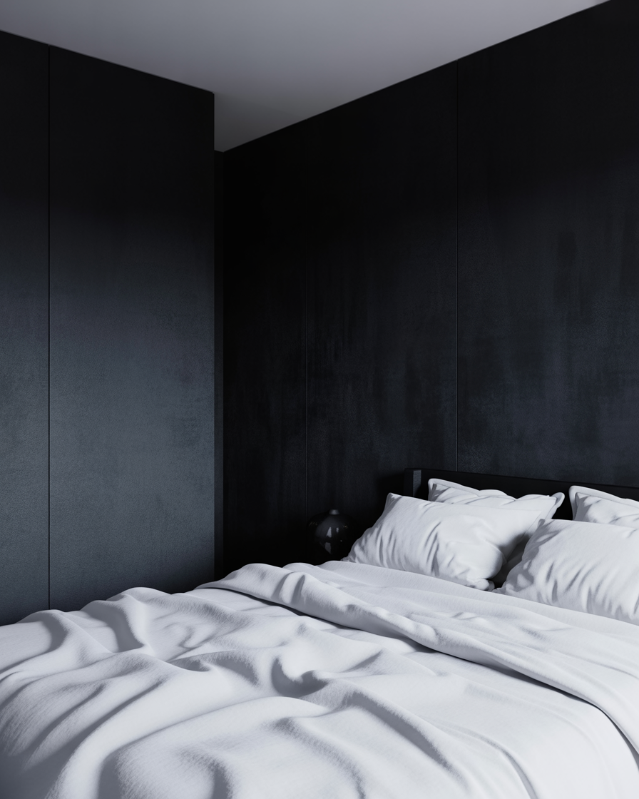 Bold moody bedroom with black walls and white contrast adding drama and balance to the room.